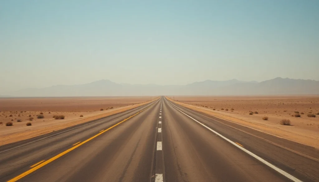 A long empty desert highway stretching toward distant mountains